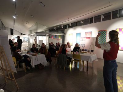 Photo of facilitator presenting information in a workshop setting. 